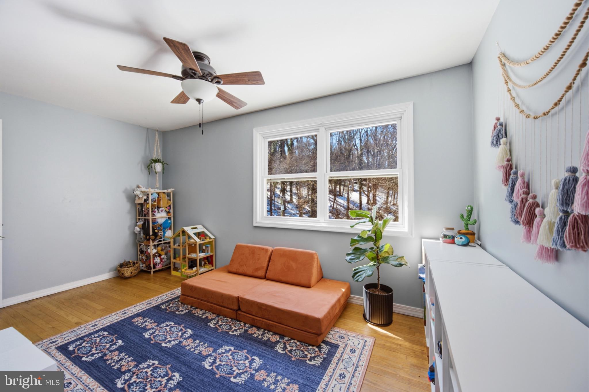 6750 Glenkirk Road Baltimore, MD 21239 - Photo 28 of 60 a living room with furniture and a window