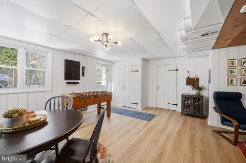 a view of a livingroom with furniture and floor to ceiling window