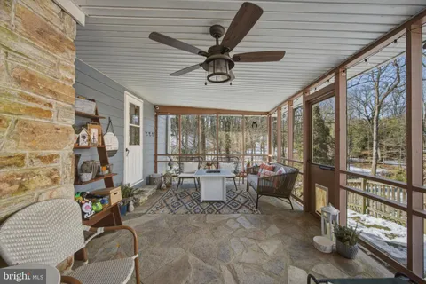 a view of a yard with snow on the road