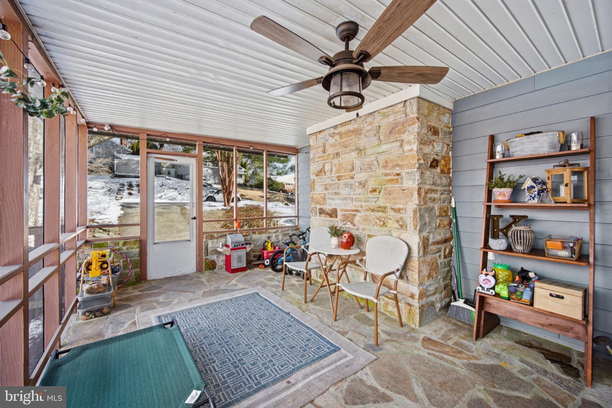 6750 Glenkirk Road Baltimore, MD 21239 - Photo 40 of 60 a view of an chairs and tables in a patio