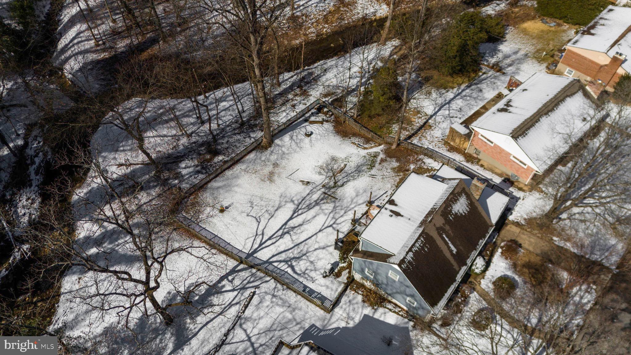 6750 Glenkirk Road Baltimore, MD 21239 - Photo 51 of 60 an aerial view of a house with a yard
