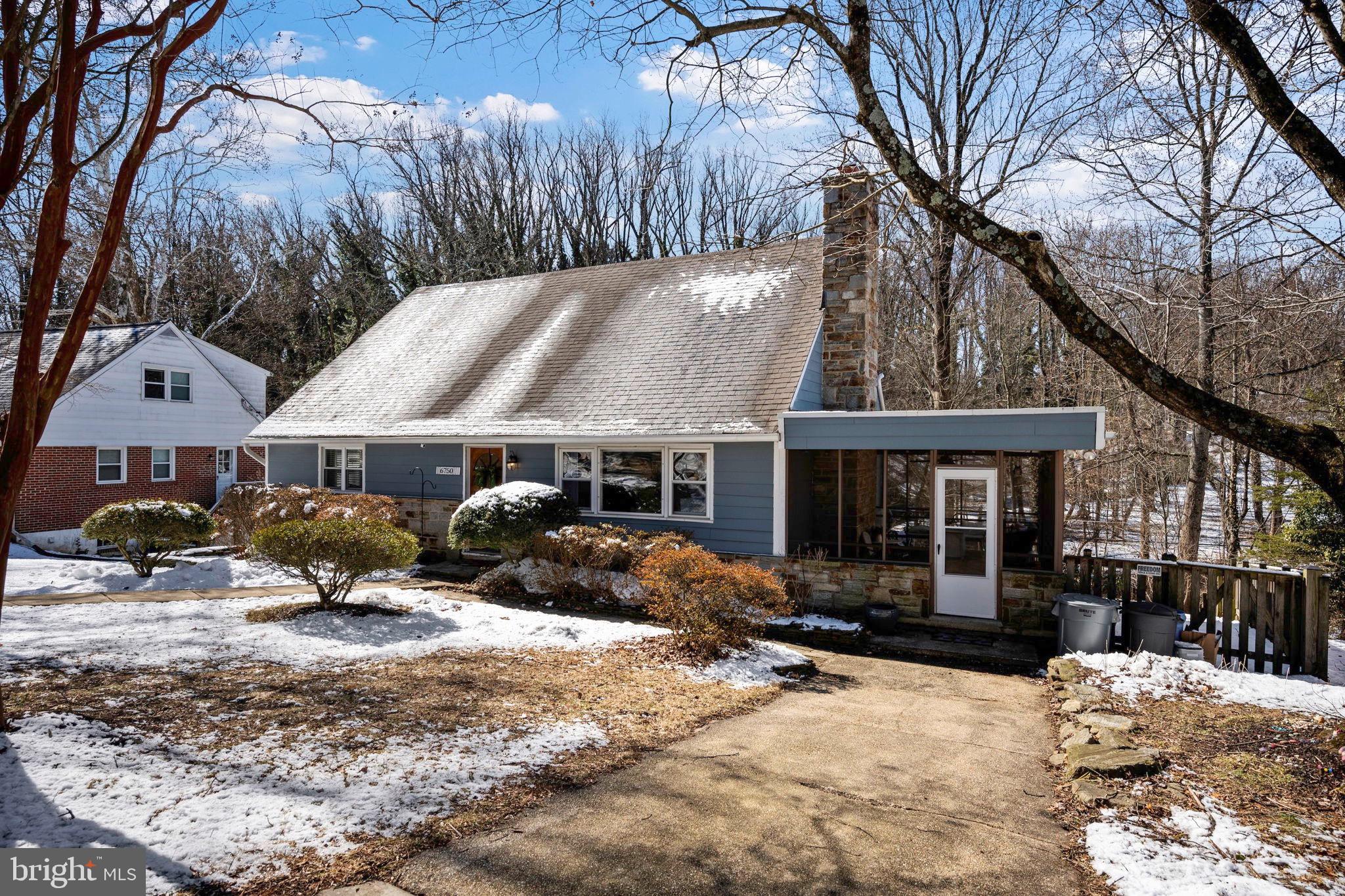 6750 Glenkirk Road Baltimore, MD 21239 - Photo 55 of 60 a front view of a house with a yard covered with snow in front of house