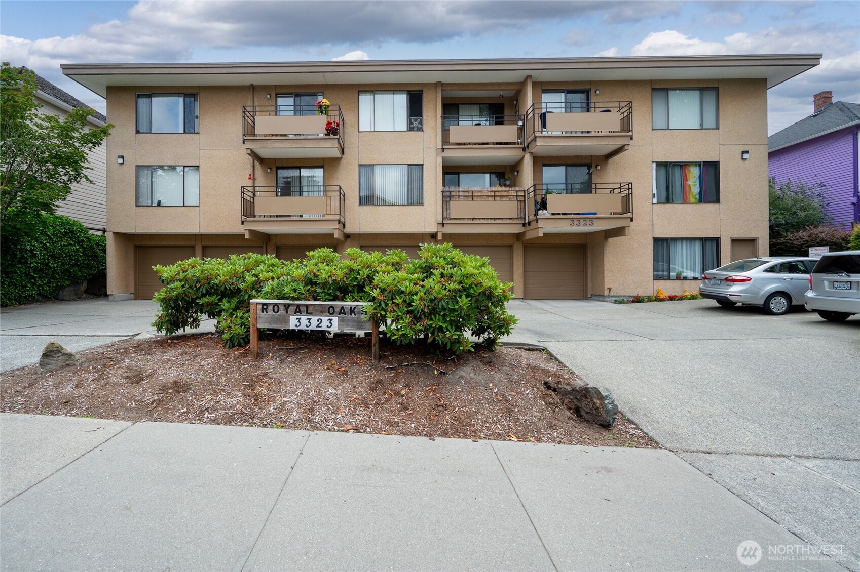 3323 Oakes Avenue, Unit 112 Everett, WA 98201 - Photo 1 of 31 a view of a car parked in front of a building