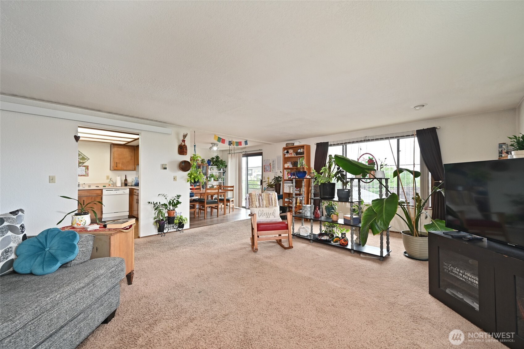 3323 Oakes Avenue, Unit 112 Everett, WA 98201 - Photo 12 of 31 a living room with furniture and a flat screen tv