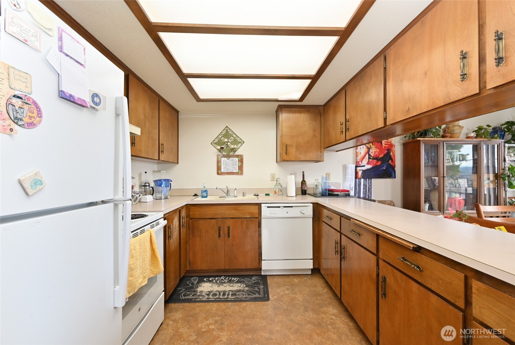 3323 Oakes Avenue, Unit 112 Everett, WA 98201 - Photo 13 of 31 a kitchen with a refrigerator and a sink