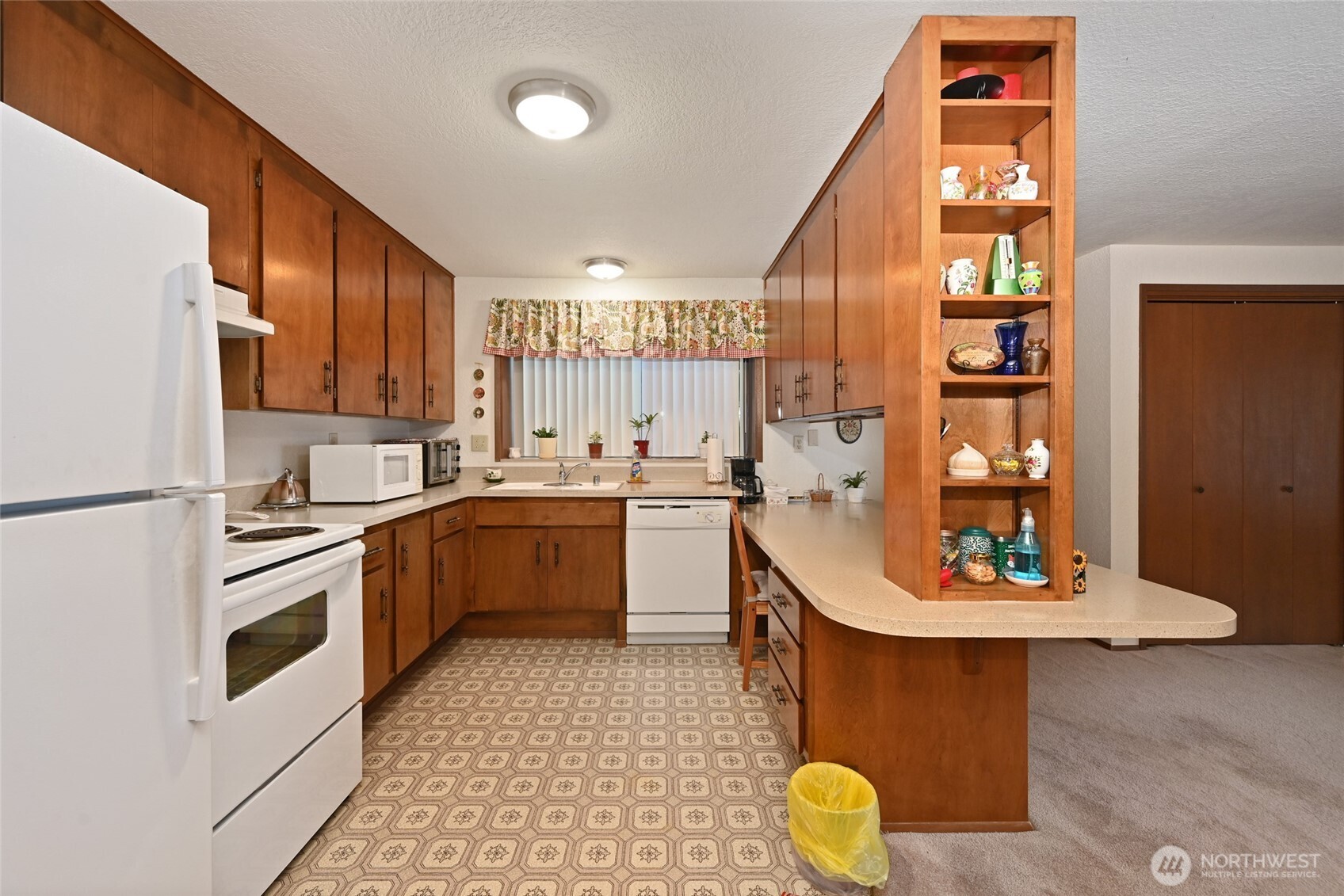 3323 Oakes Avenue, Unit 112 Everett, WA 98201 - Photo 14 of 31 a kitchen with a sink appliances and cabinets