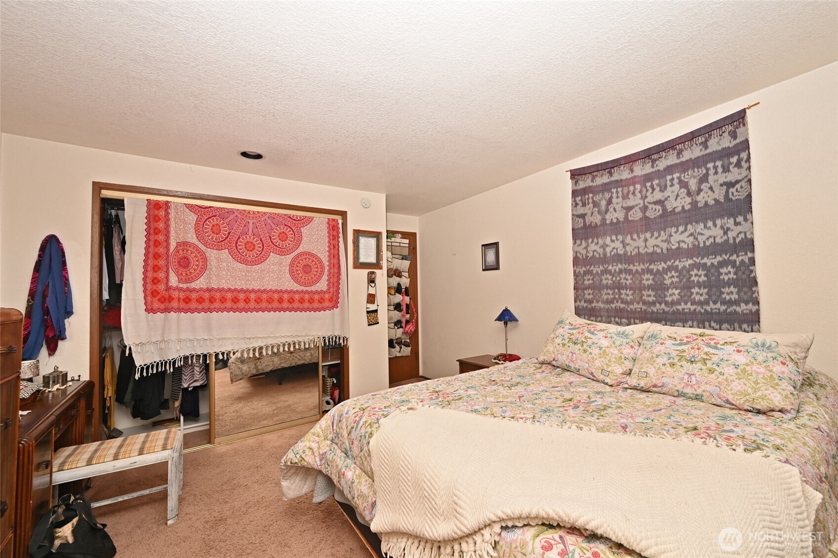 3323 Oakes Avenue, Unit 112 Everett, WA 98201 - Photo 18 of 31 a bedroom with a bed and a flat screen tv