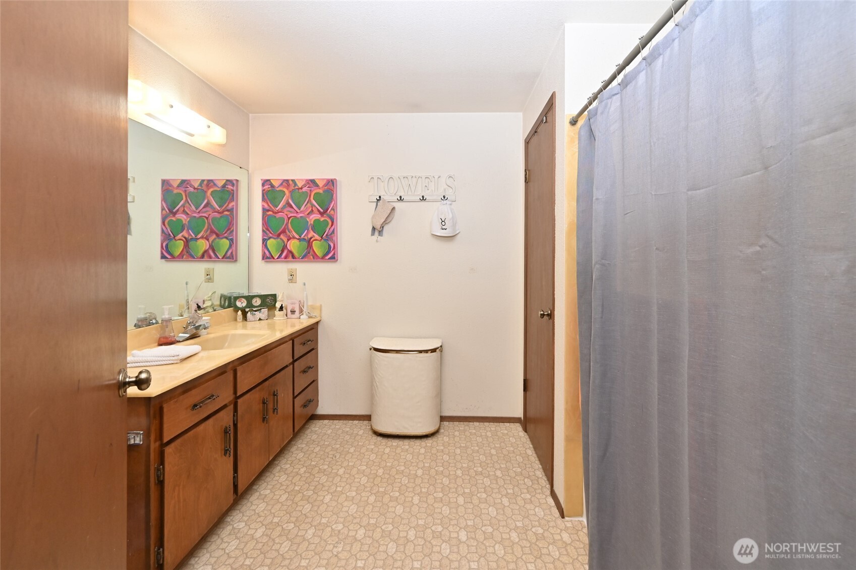 3323 Oakes Avenue, Unit 112 Everett, WA 98201 - Photo 19 of 31 a bathroom with a double vanity sink toilet and shower