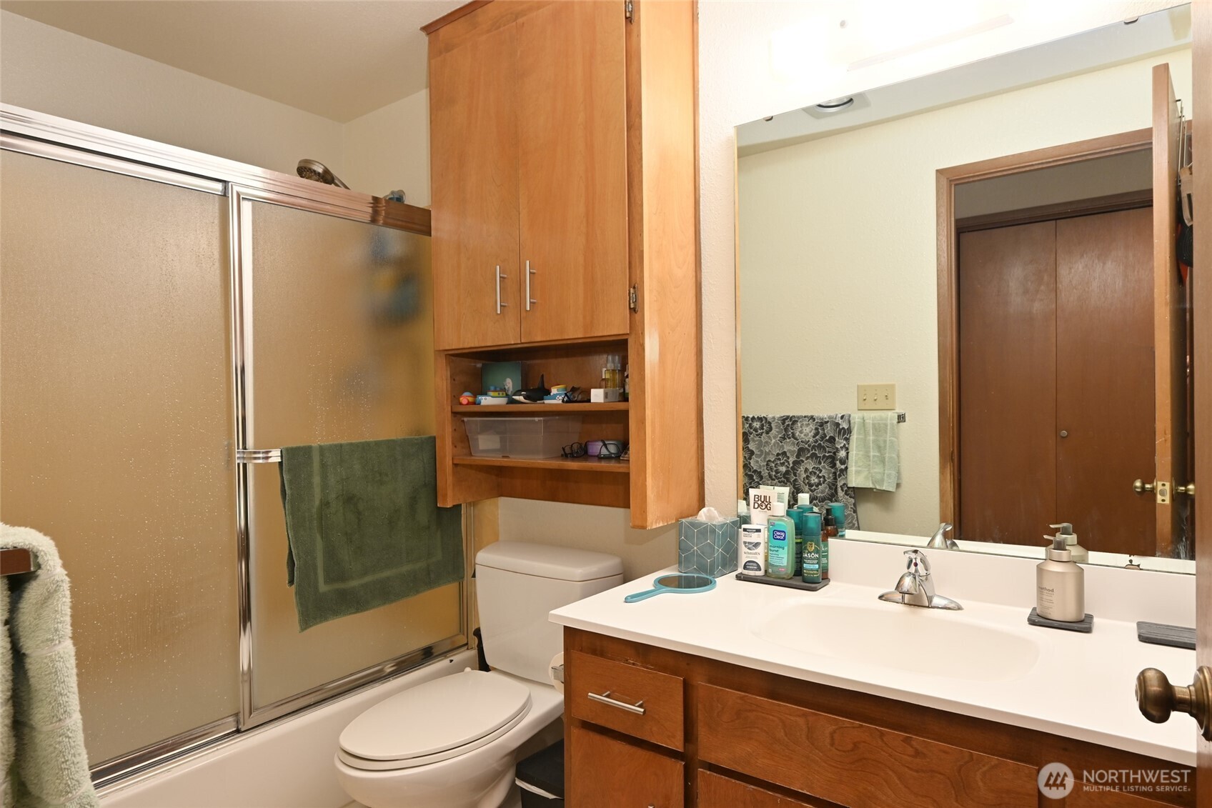 3323 Oakes Avenue, Unit 112 Everett, WA 98201 - Photo 20 of 31 a bathroom with a sink a toilet and shower