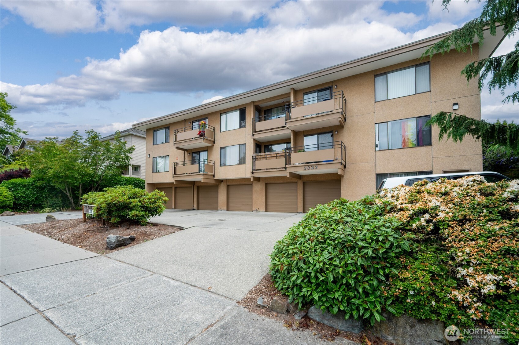 3323 Oakes Avenue, Unit 112 Everett, WA 98201 - Photo 2 of 31 front view of a house with a garden