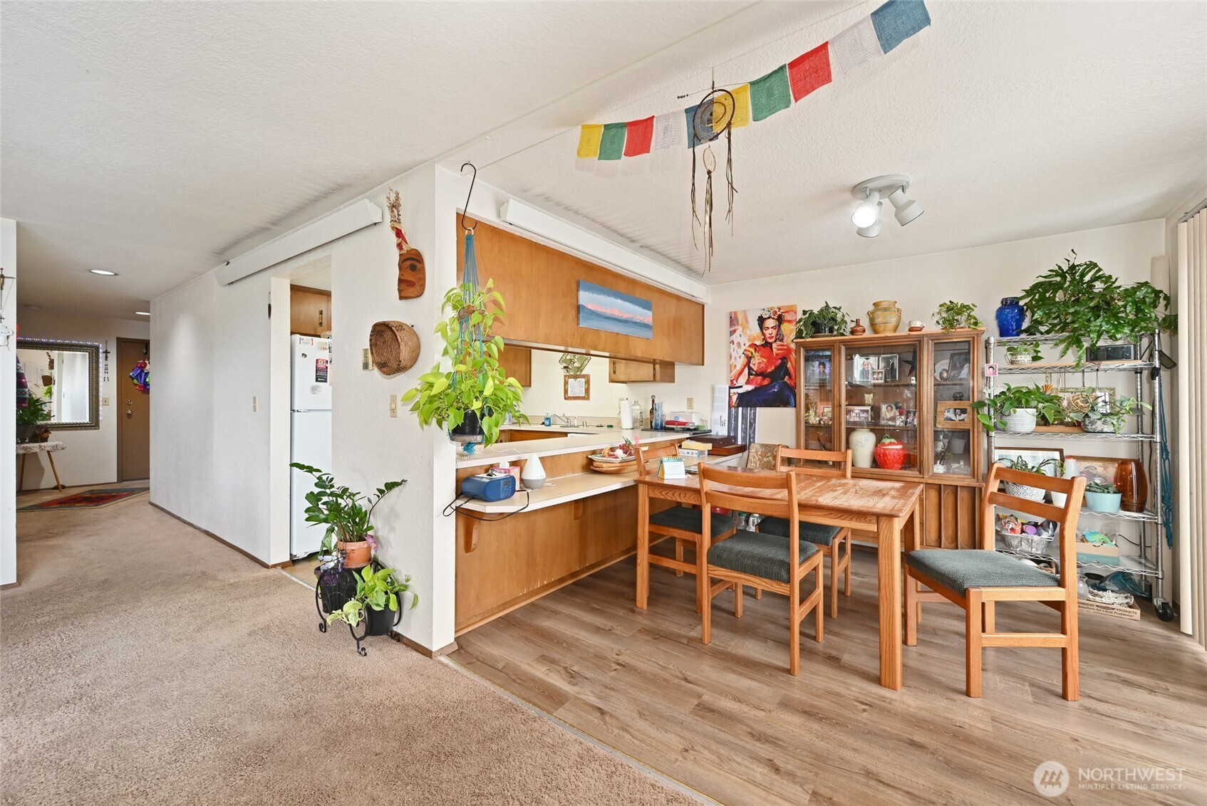 3323 Oakes Avenue, Unit 112 Everett, WA 98201 - Photo 8 of 31 a view of a dining room with furniture and wooden floor