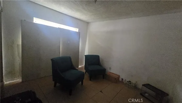 a view of a room with furniture and a gate