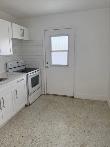 a view of a kitchen with a sink