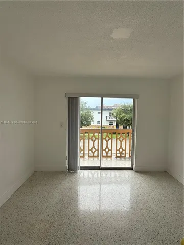 an empty room with a large window