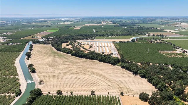 an aerial view of a house with a lake view