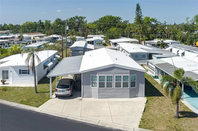 a group of cars parked in front of a house