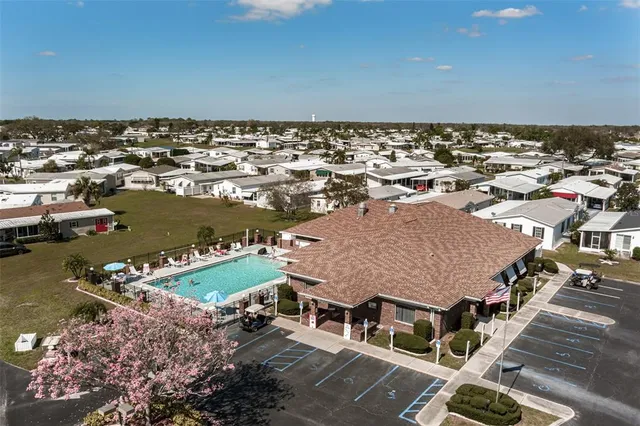 an aerial view of a house with a ocean view