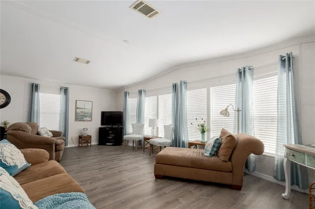 a living room with furniture and a window