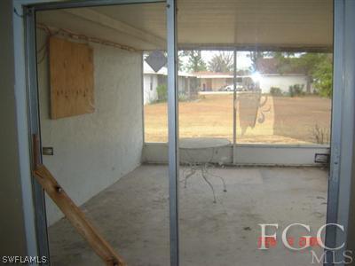 108 Florida Road Lehigh Acres, FL 33936 - Photo 3 of 10 a bathroom with a tub and shower