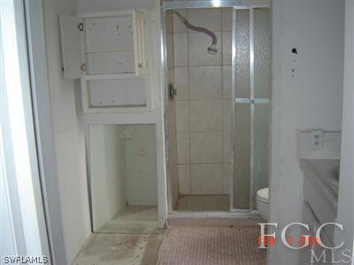 108 Florida Road Lehigh Acres, FL 33936 - Photo 9 of 10 a bathroom with a shower