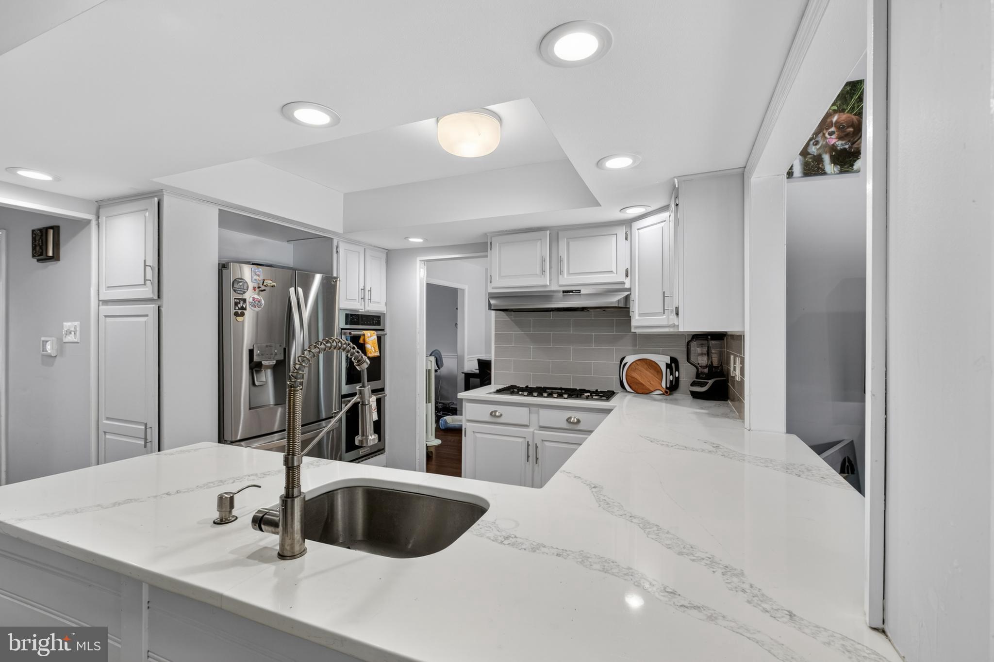 216 Revere Road Marlton, NJ 08053 - Photo 6 of 47 a kitchen with stainless steel appliances a sink stove and refrigerator