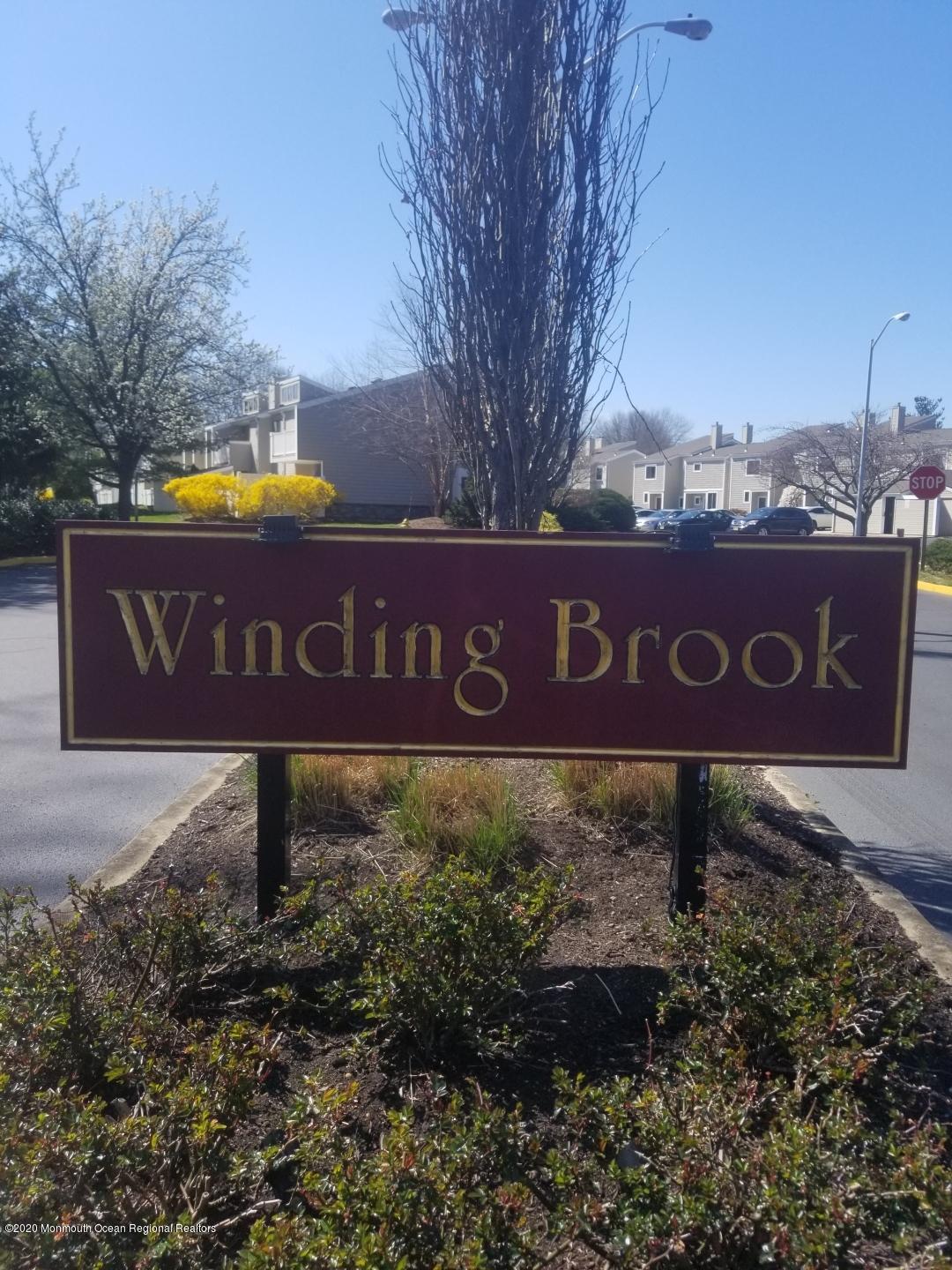 14 Carol Court Tinton Falls, NJ 07724 - Photo 1 of 13 a sign broad in front of red brick house