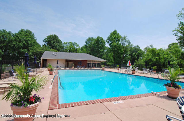 14 Carol Court Tinton Falls, NJ 07724 - Photo 12 of 13 a view of a house with swimming pool and sitting area