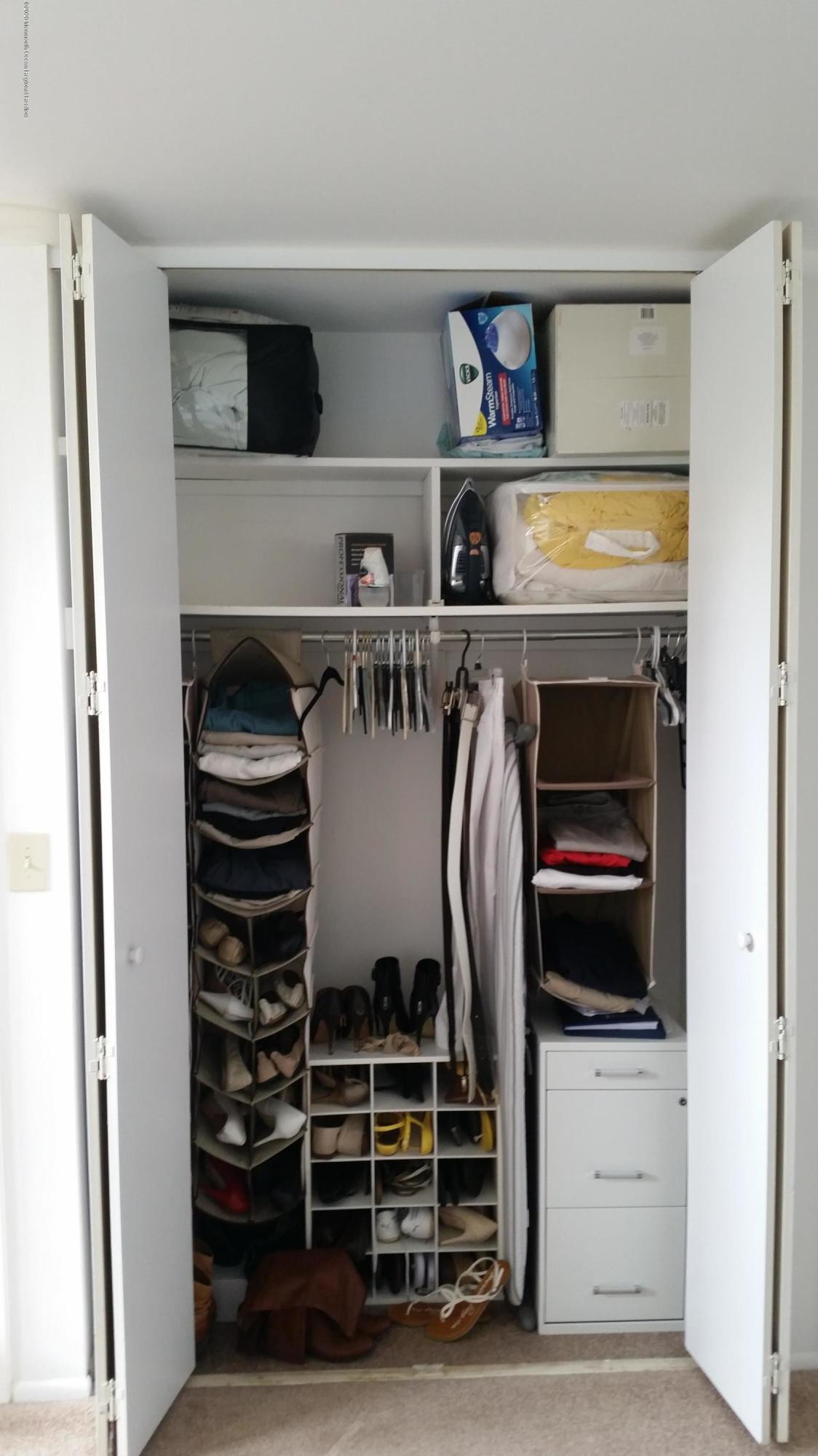 14 Carol Court Tinton Falls, NJ 07724 - Photo 5 of 13 a view of walk in closet with clothes and shoes