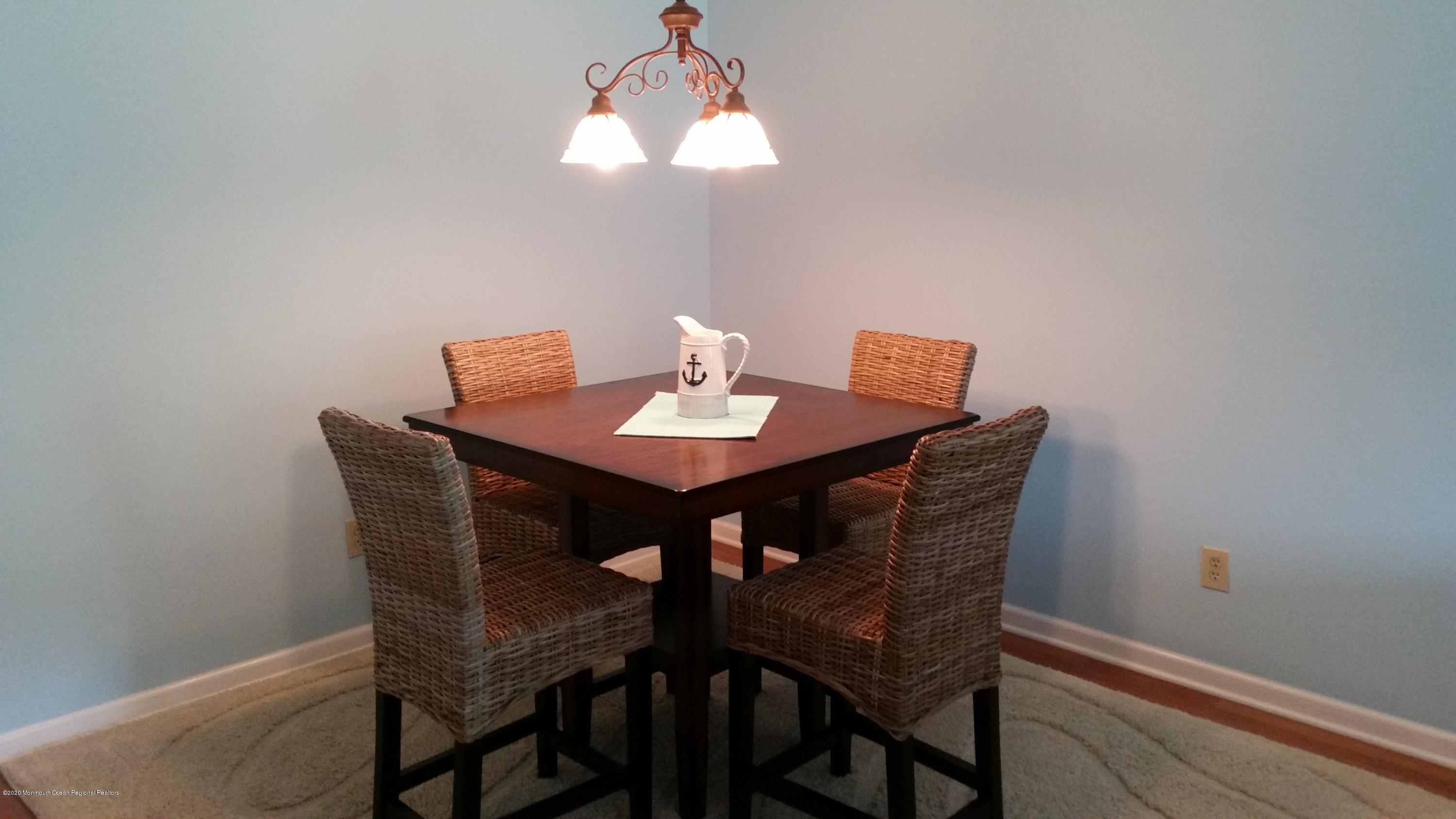 14 Carol Court Tinton Falls, NJ 07724 - Photo 7 of 13 a view of a dining room with a table and chairs