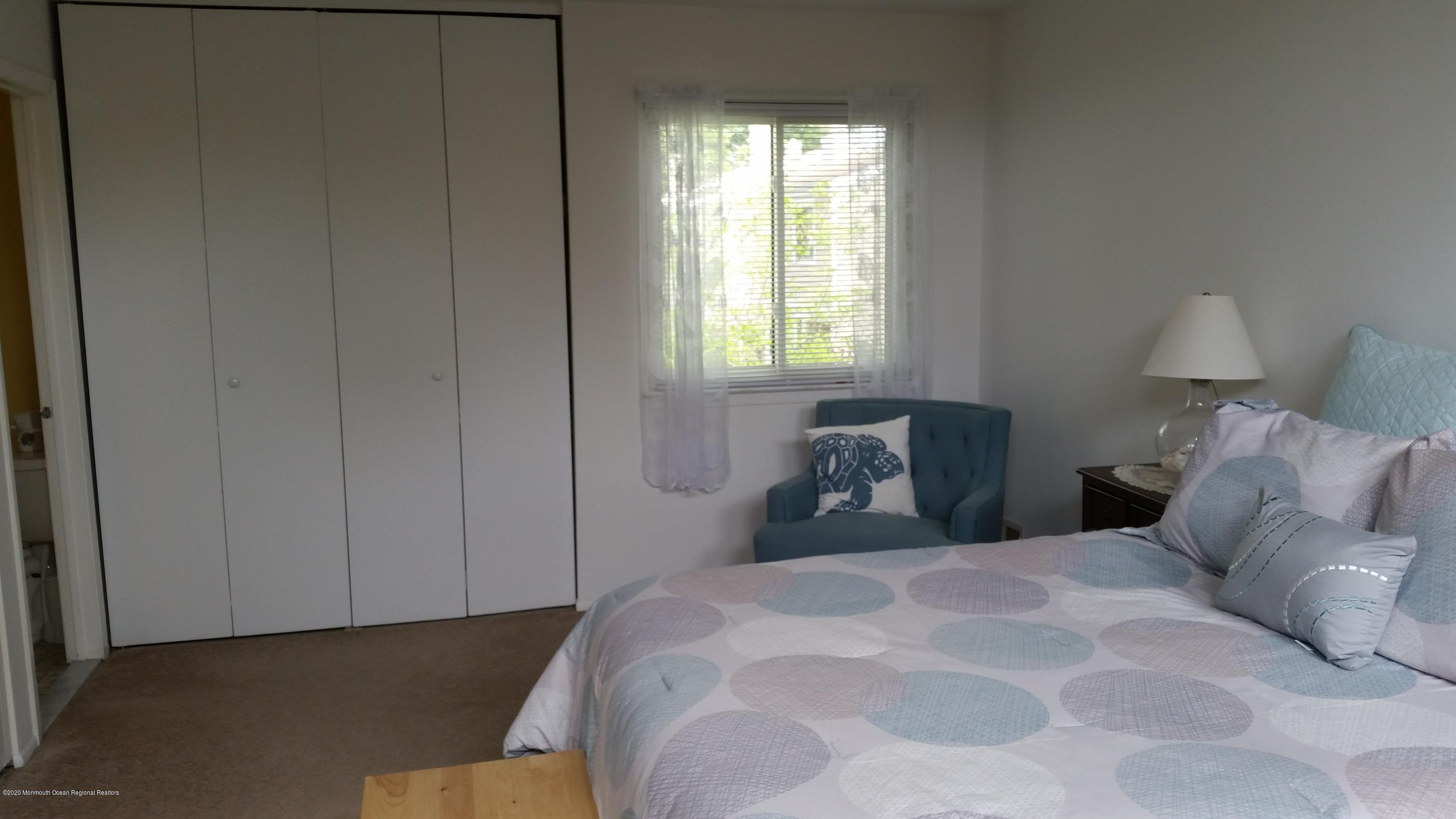 14 Carol Court Tinton Falls, NJ 07724 - Photo 10 of 13 a bedroom with a bed and a window