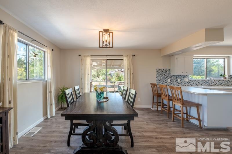 175 Greenstone Drive Reno, NV 89512 - Photo 12 of 33 a view of a dining room with furniture window and wooden floor