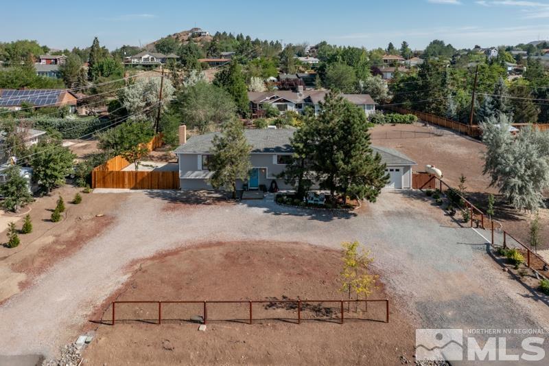 175 Greenstone Drive Reno, NV 89512 - Photo 4 of 33 an aerial view of a house with a yard and parking spaces