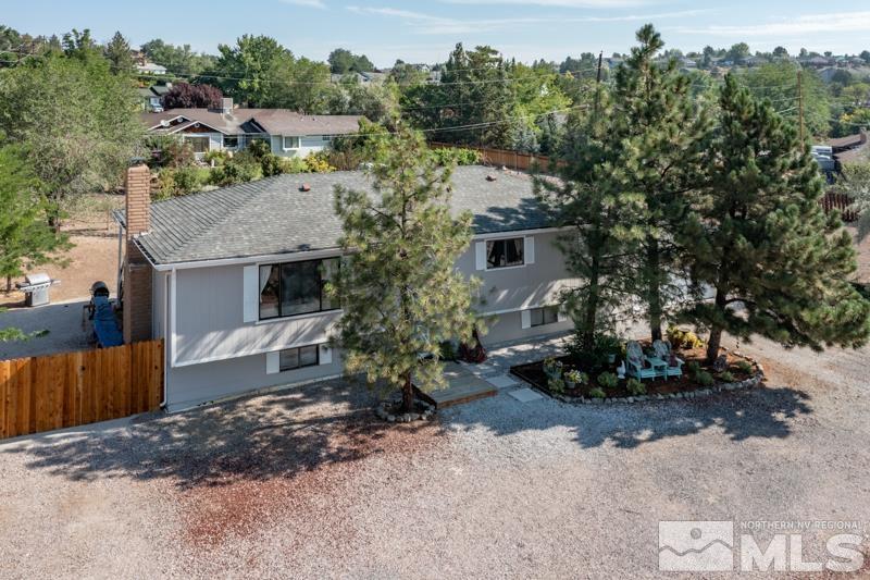 175 Greenstone Drive Reno, NV 89512 - Photo 7 of 33 a view of a house with a backyard and trees