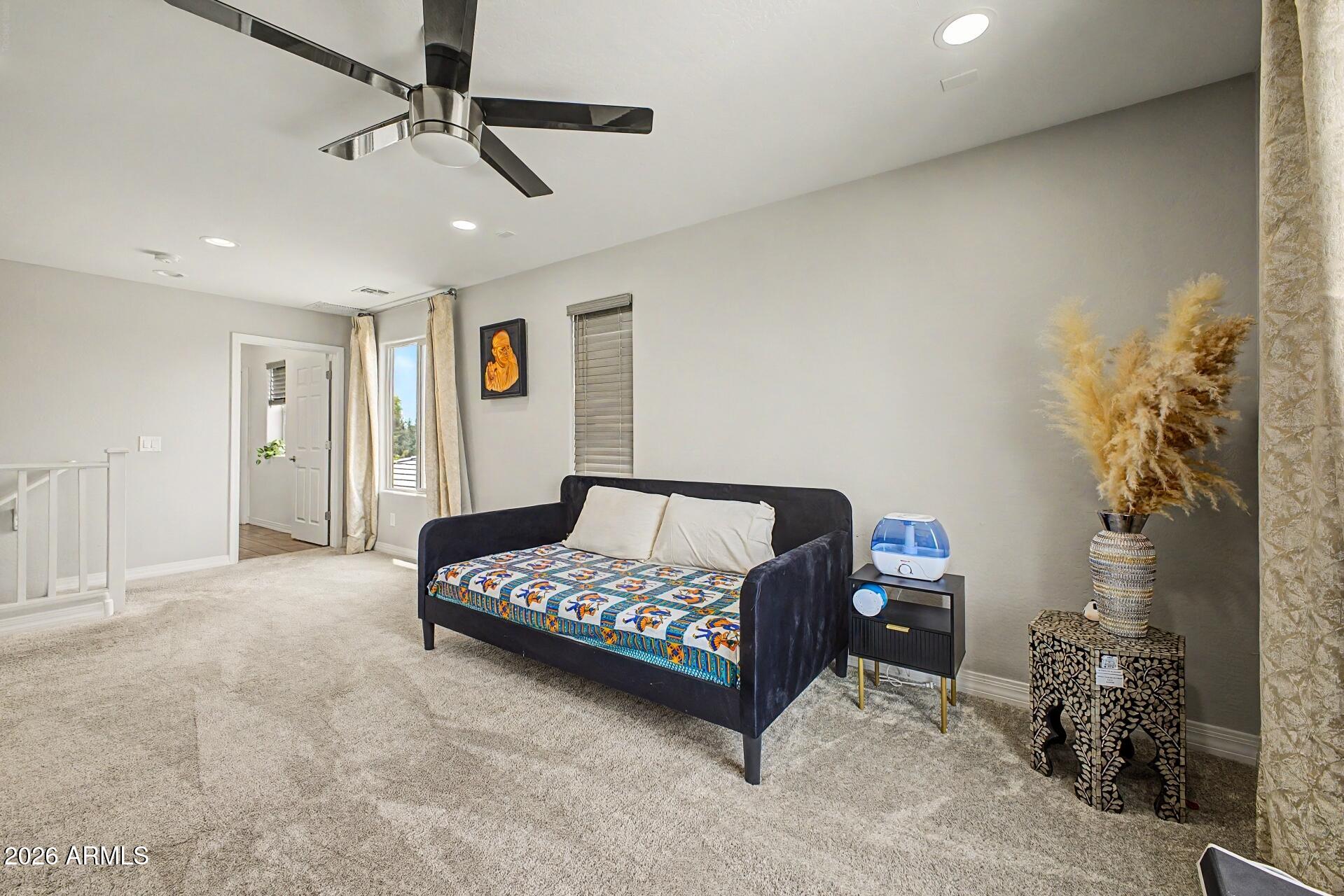 701 East Liberty Lane Gilbert, AZ 85296 - Photo 14 of 46 a bedroom with a bed dresser and a window