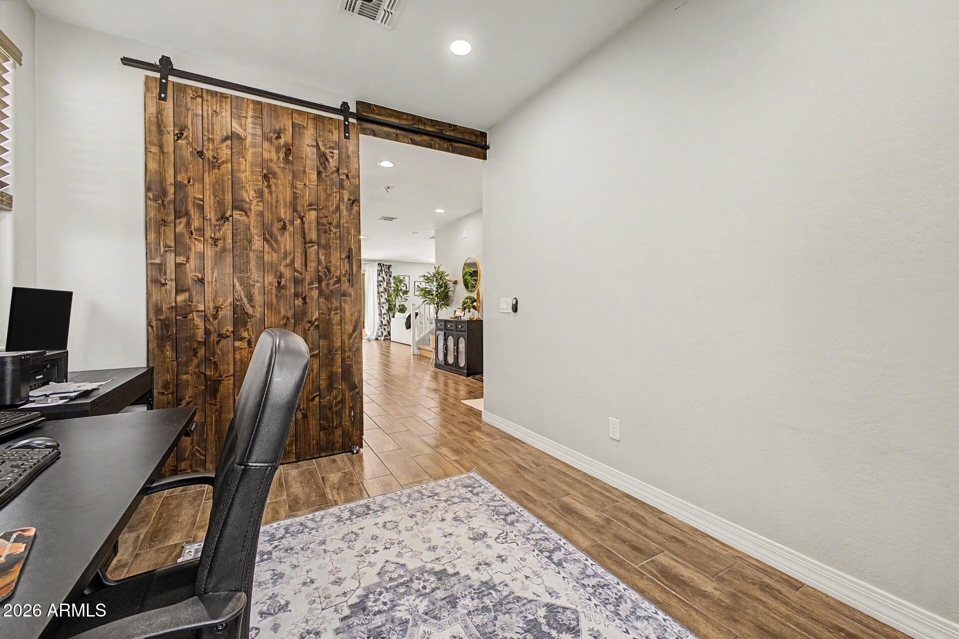 701 East Liberty Lane Gilbert, AZ 85296 - Photo 31 of 46 a view of a workspace with furniture and a window