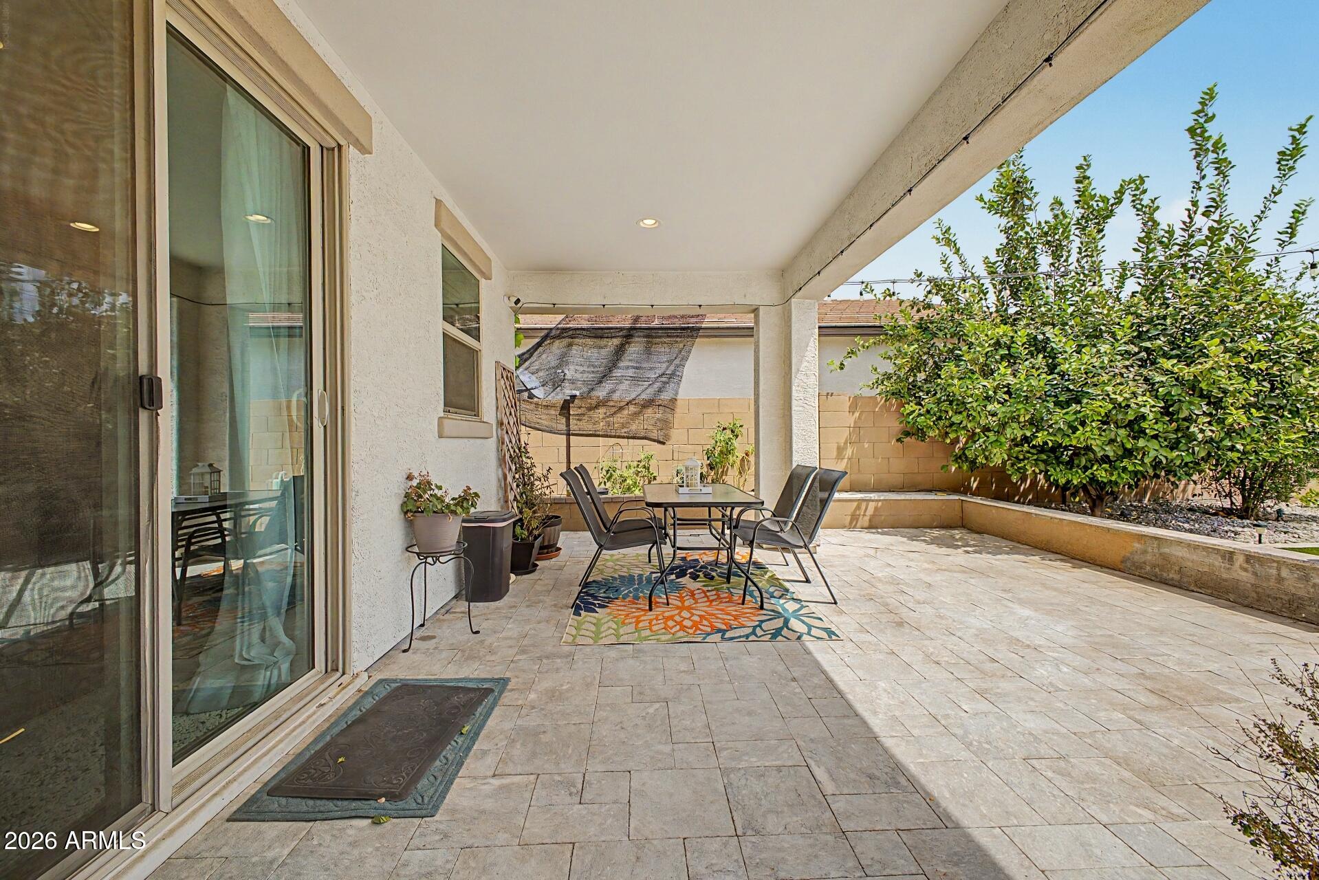 701 East Liberty Lane Gilbert, AZ 85296 - Photo 36 of 46 a view of a patio with table and chairs and potted plants
