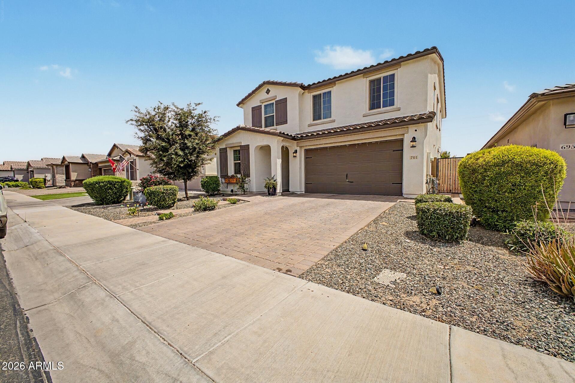 701 East Liberty Lane Gilbert, AZ 85296 - Photo 43 of 46 a front view of a house with a yard and garage