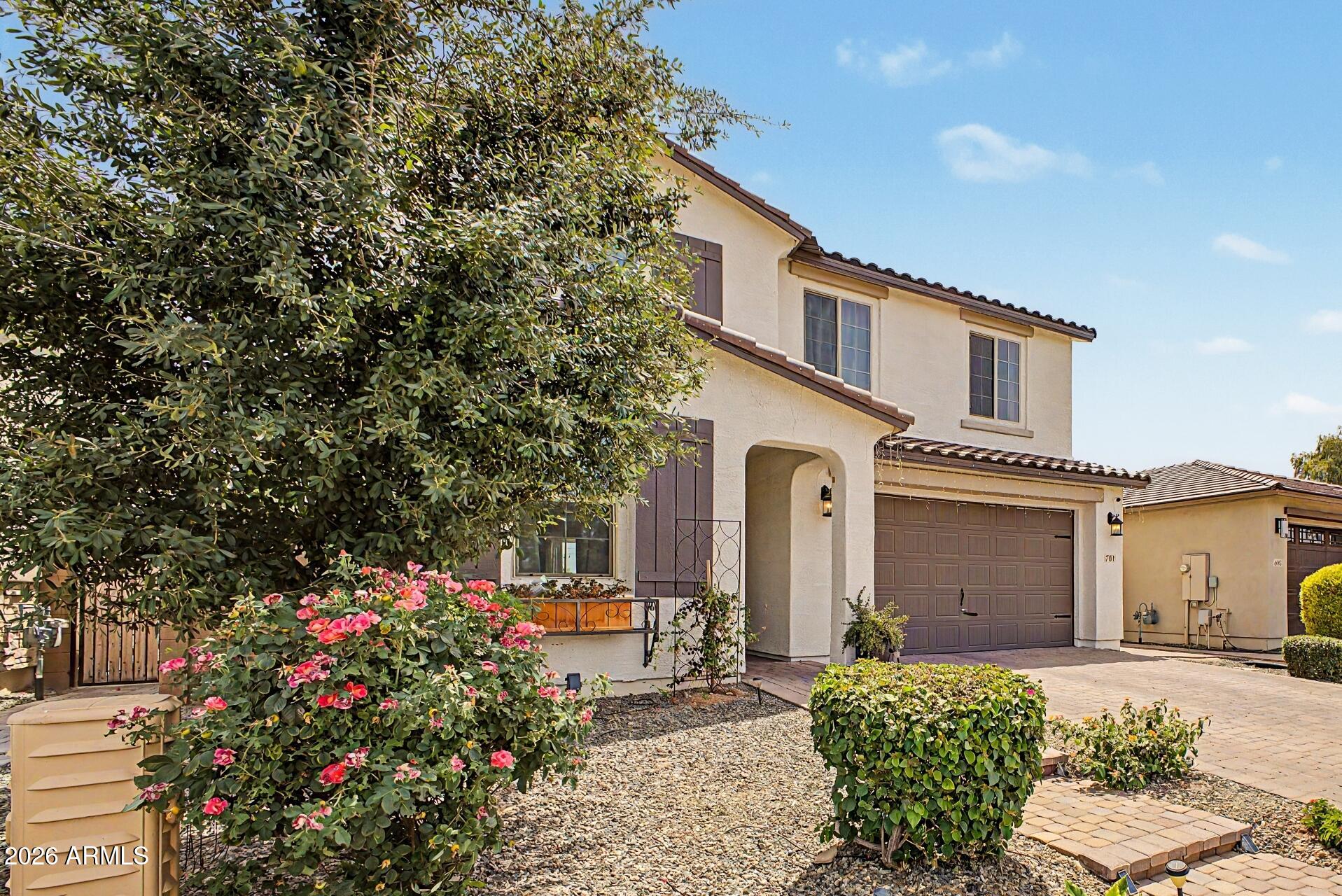 701 East Liberty Lane Gilbert, AZ 85296 - Photo 46 of 46 a front view of a house with a garden