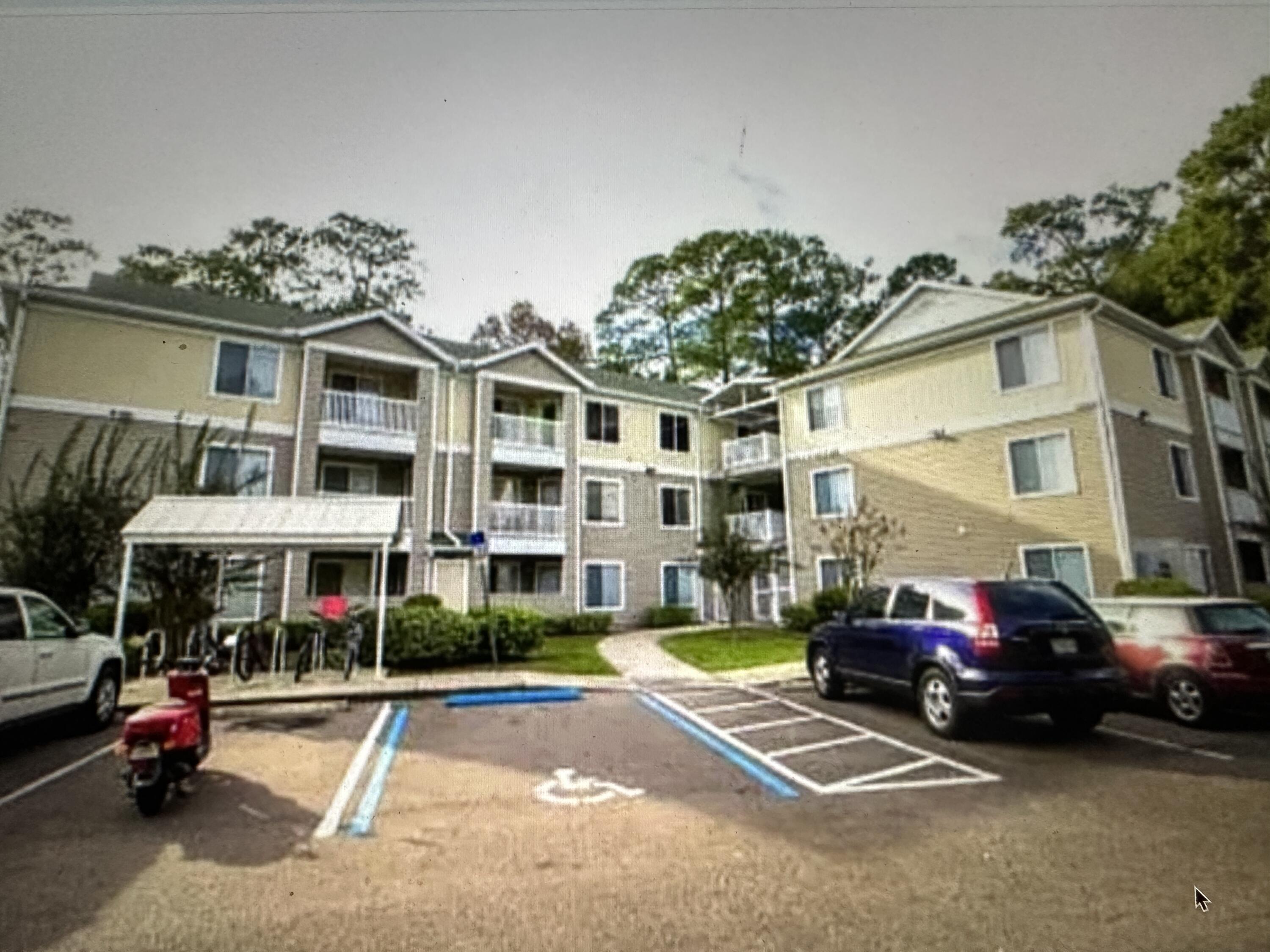 4000 Southwest 23rd Street, Unit 2201 Gainesville, FL 32608 - Photo 12 of 17 a cars parked in front of a building