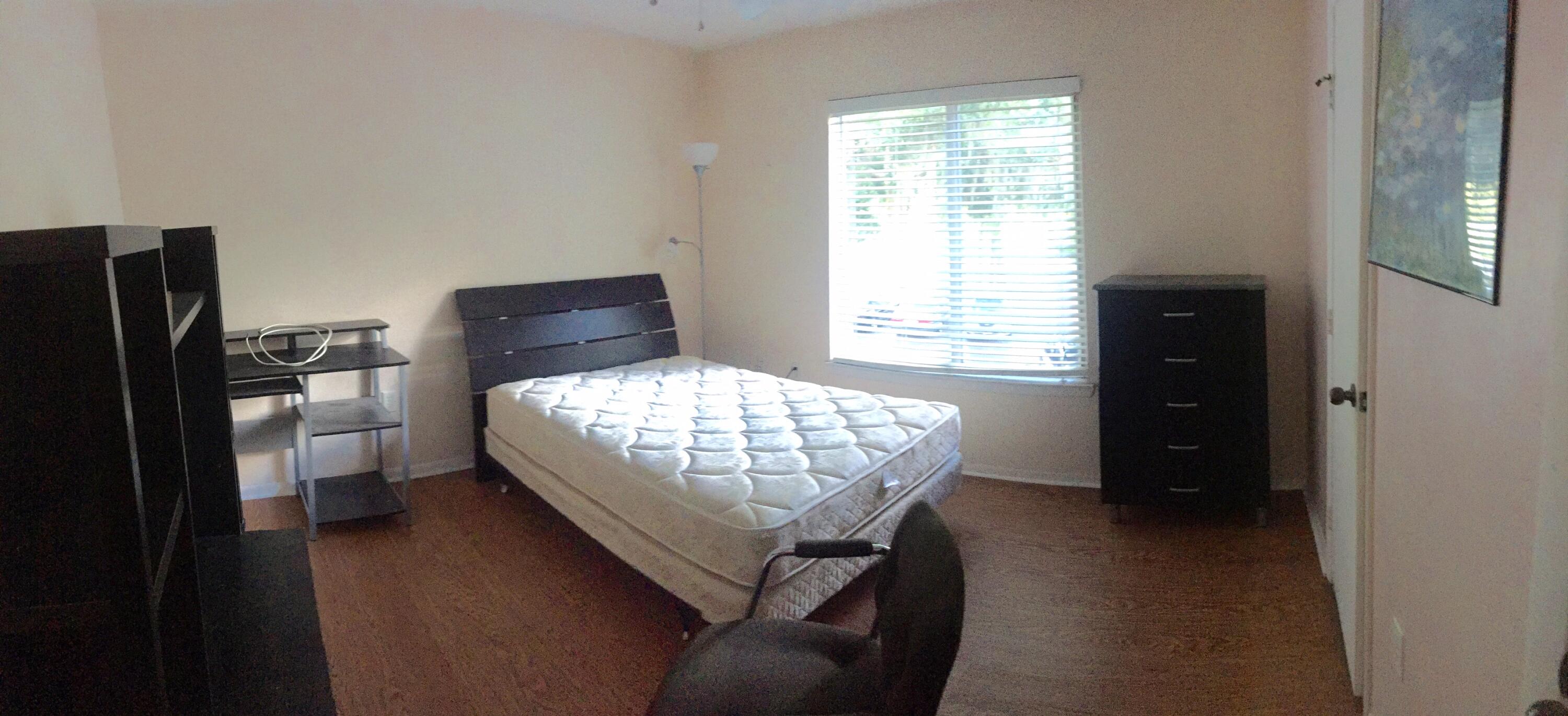 4000 Southwest 23rd Street, Unit 2201 Gainesville, FL 32608 - Photo 3 of 17 a bedroom with a bed window and a closet