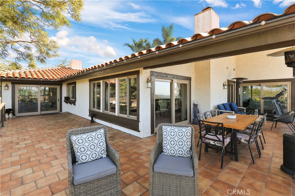 33532 Valle Road San Juan Capistrano, CA 92675 - Photo 15 of 60 a backyard of a house with table and chairs