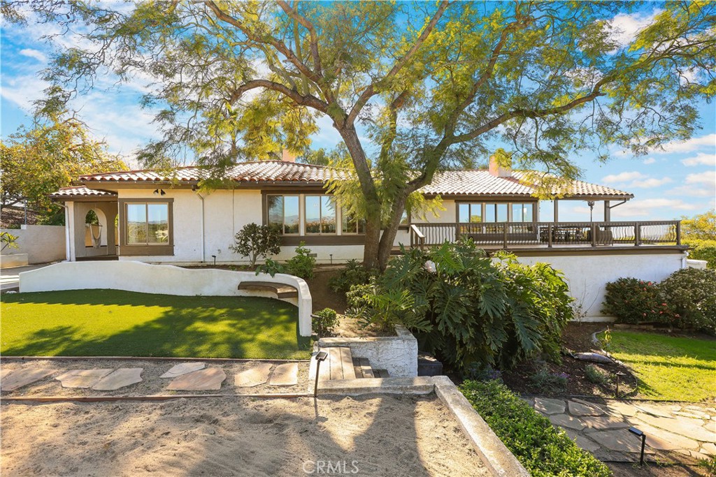 33532 Valle Road San Juan Capistrano, CA 92675 - Photo 17 of 60 a view of a swimming pool with a patio and a yard