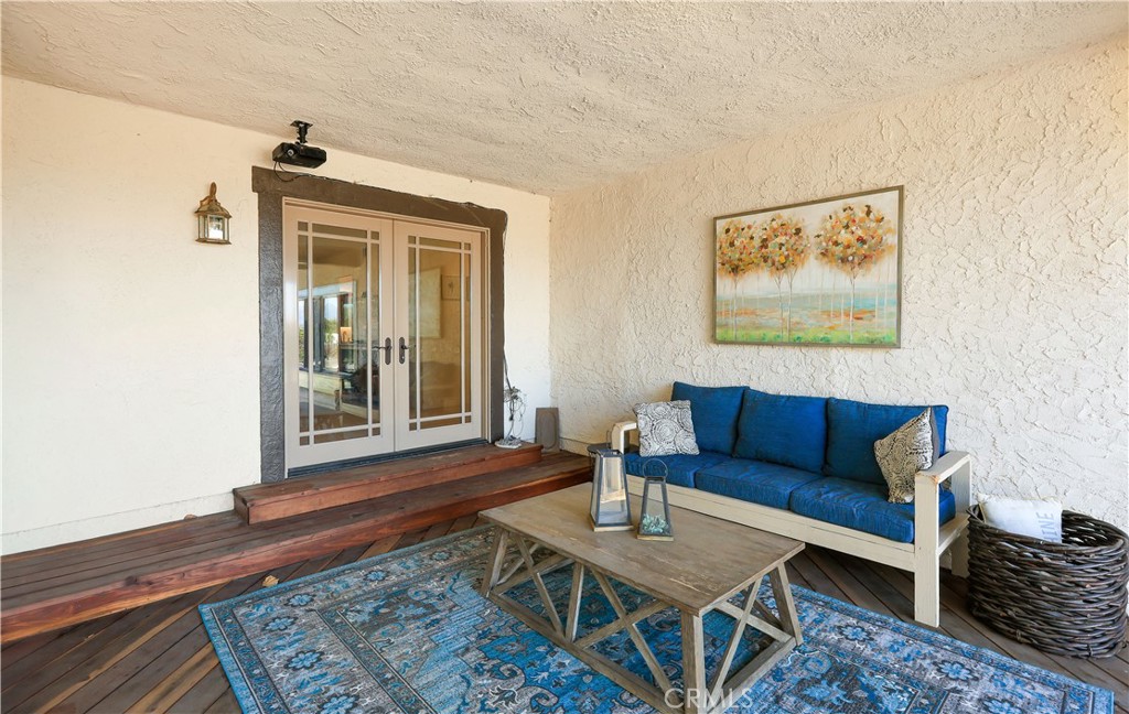 33532 Valle Road San Juan Capistrano, CA 92675 - Photo 21 of 60 a living room with furniture and a rug