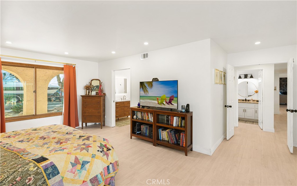 33532 Valle Road San Juan Capistrano, CA 92675 - Photo 24 of 60 a bedroom with furniture and large window