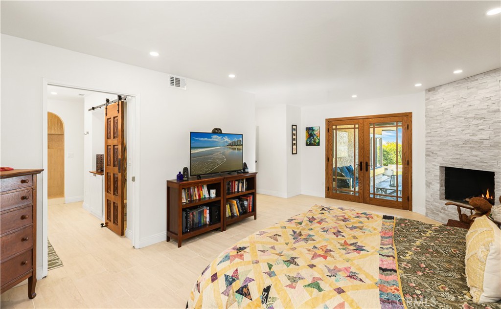 33532 Valle Road San Juan Capistrano, CA 92675 - Photo 25 of 60 a living room with furniture a flat screen tv and a refrigerator