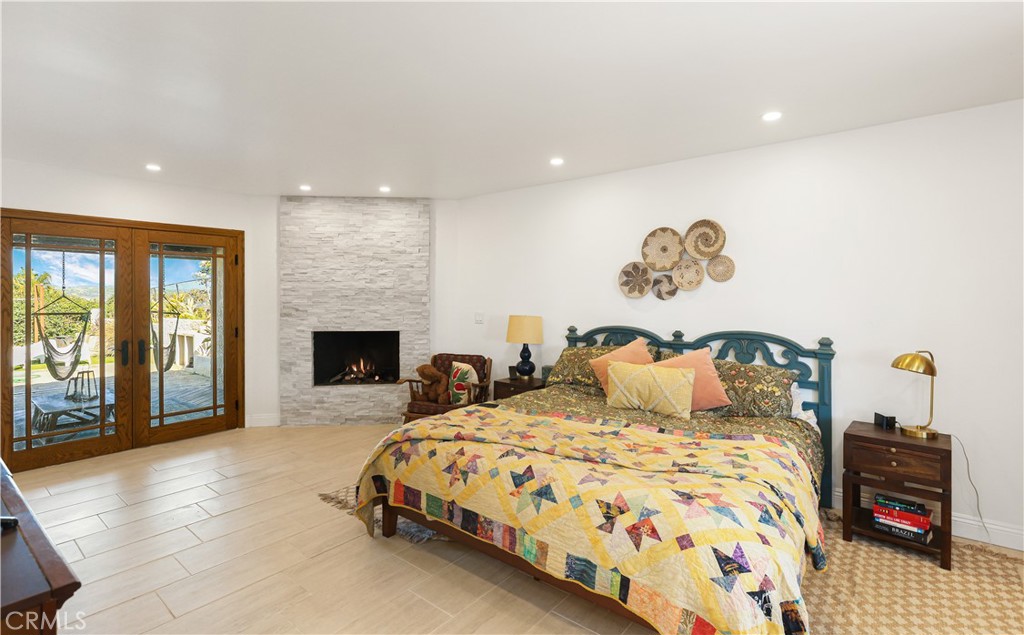33532 Valle Road San Juan Capistrano, CA 92675 - Photo 26 of 60 a bedroom with a bed and a television