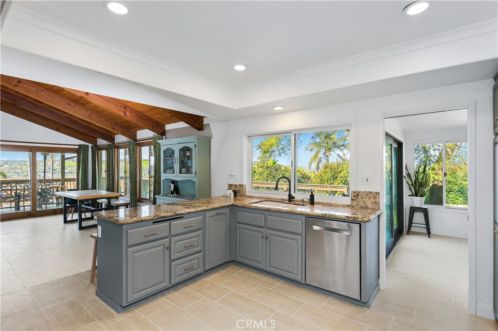 33532 Valle Road San Juan Capistrano, CA 92675 - Photo 38 of 60 a kitchen with a sink stove and cabinets