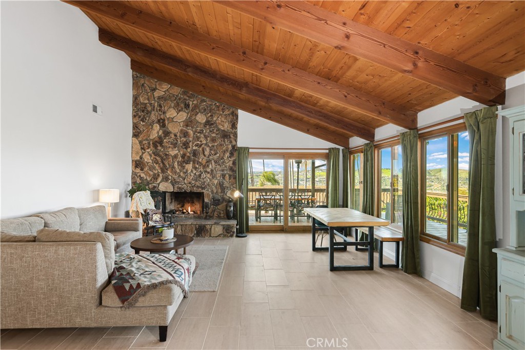 33532 Valle Road San Juan Capistrano, CA 92675 - Photo 40 of 60 a living room with furniture and a fireplace