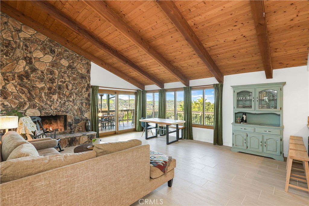 33532 Valle Road San Juan Capistrano, CA 92675 - Photo 41 of 60 a living room with furniture and large windows