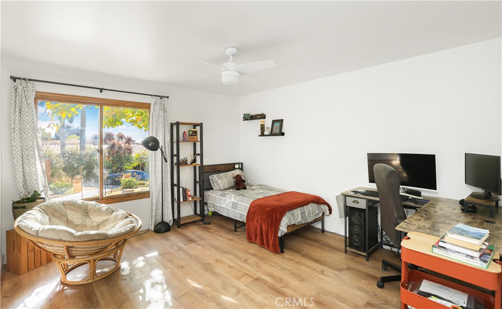 33532 Valle Road San Juan Capistrano, CA 92675 - Photo 44 of 60 a bedroom with a bed and a desk